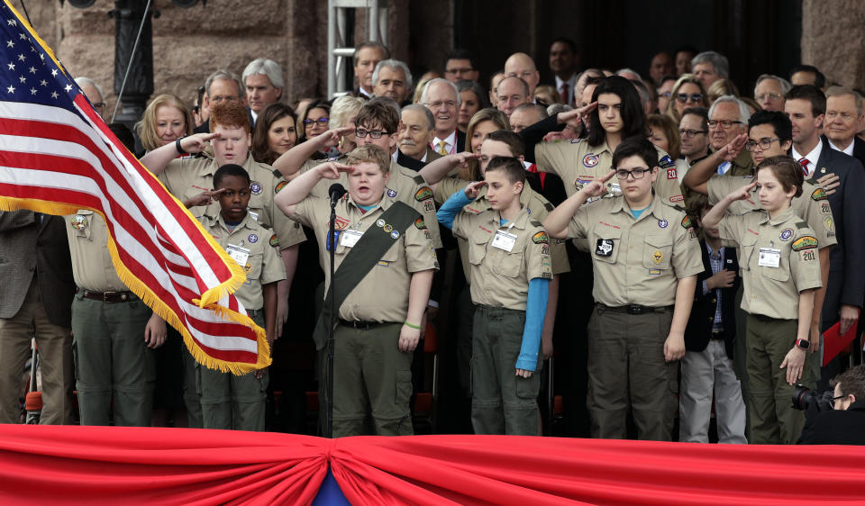 Scouts from Longview, Texas, lead in the Pledge of Allegiance during the inauguration ceremony for Texas Gov. Greg Abbott and Texas Lt. Gov. Dan Patrick, in Austin, Texas, Tuesday, Jan. 15, 2019. (AP Photo/Eric Gay)