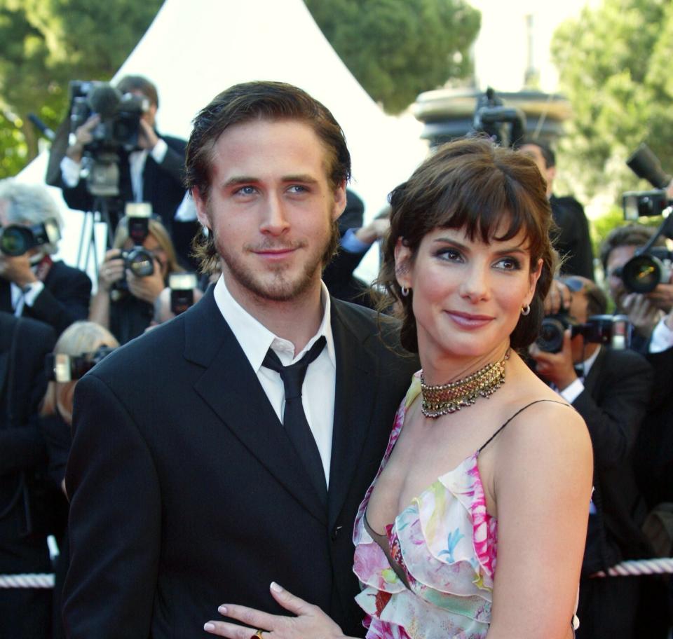 sandra hugging ryan on the cannes red carpet