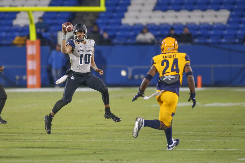 Utah State Aggies QB Jordan Love (10) rolls out to pass during the Frisco Bowl on Dec.20, 2019. (George Walker/Icon Sportswire via Getty Images)