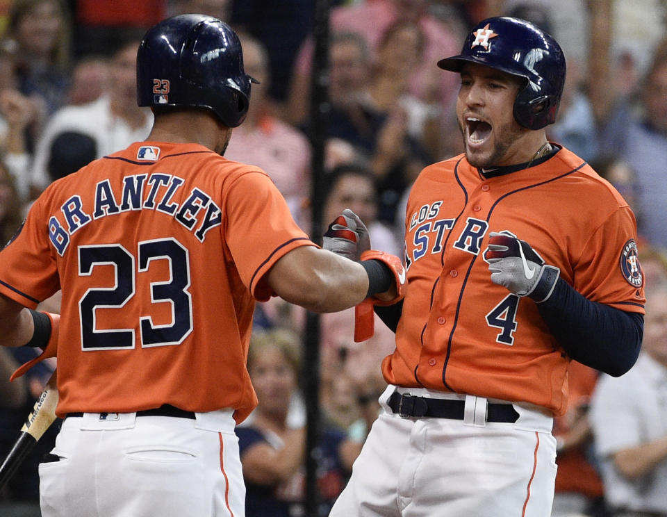 Houston Astros' George Springer, right, celebrates his two-run home run off Los Angeles Angels relief pitcher Jose Rodriguez with Michael Brantley during the second inning of a baseball game Sunday, Sept. 22, 2019, in Houston. (AP Photo/Eric Christian Smith)