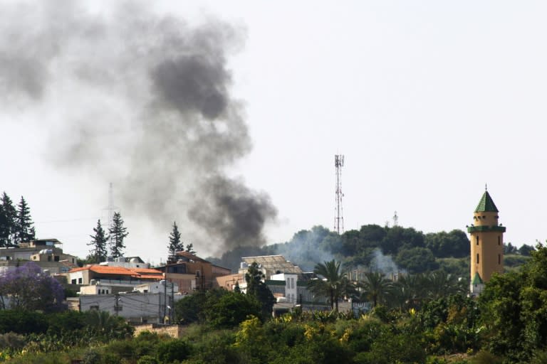 Smoke billows over the Lebanese village of Najjariyeh, where official media says Israel struck (MAHMOUD ZAYYAT)