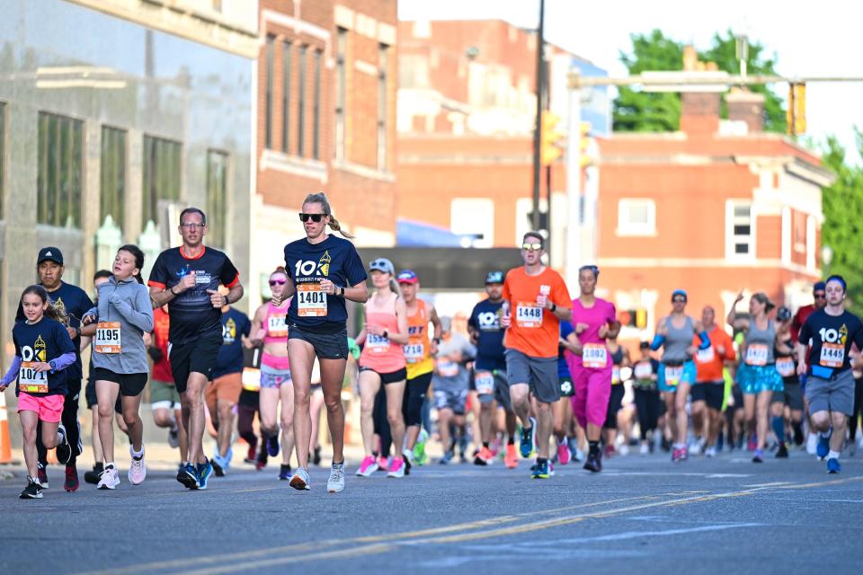10K runners run along Colfax Avenue on Saturday, June 4, 2022, during the Sunburst Races in South Bend.