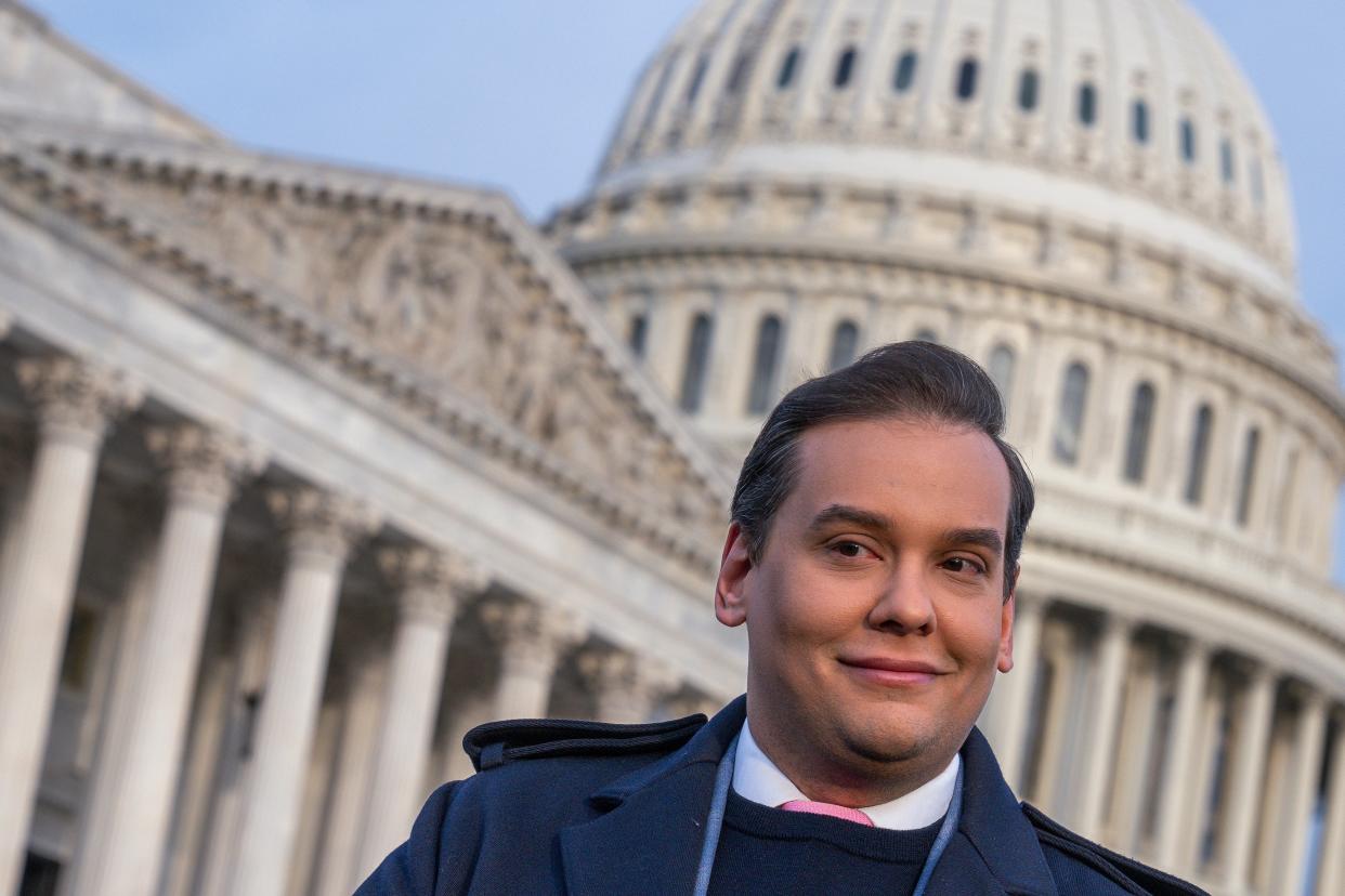 Rep. George Santos, R-N.Y., faces reporters at the Capitol in Washington, early Thursday, Nov. 30, 2023 (AP)