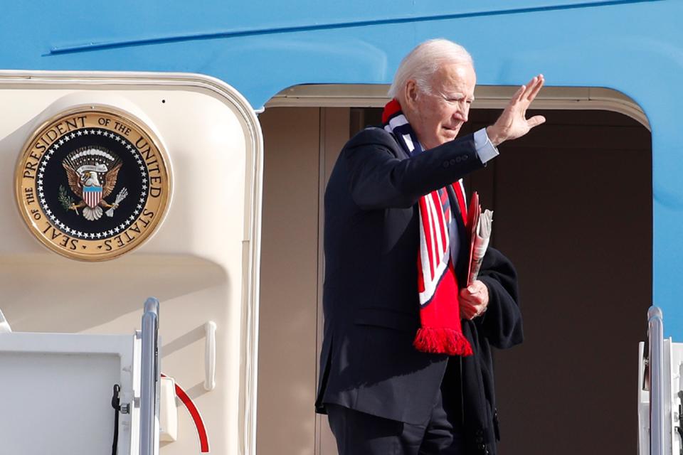 President Joe Biden waves from the stairs of Air Force One at Andrews Air Force Base, Md., Friday, Dec. 2, 2022 (AP)