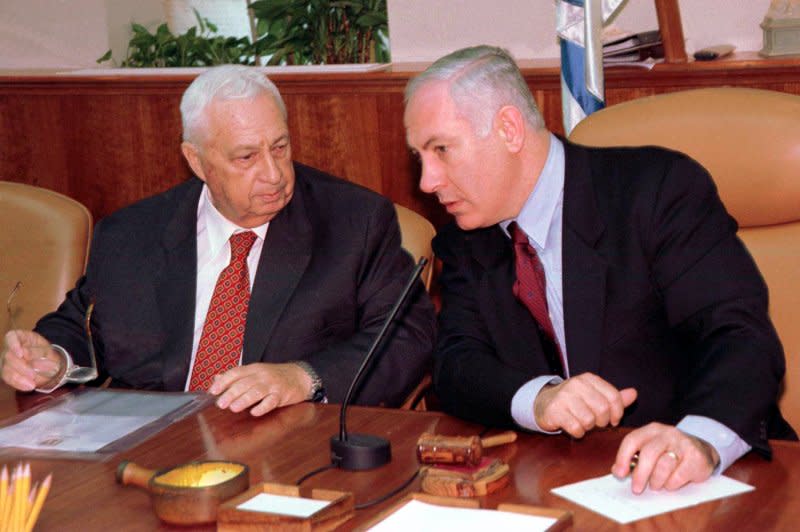 Israeli Prime Minister Benjamin Netaynayhu confers with Foreign Minister Ariel Sharon in his Jerusalem office November 19, 1998. On December 21, 1998, the shaky coalition of Netanyahu collapsed when Israel's parliament voted 81-30 to dissolve the government. File Photo by Debbie Hill/UPI