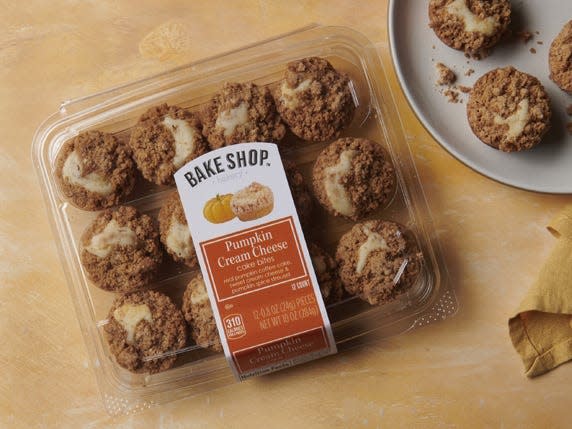 Alid's Bake Shop coffee-cake bites on a wooden table next to a plate of bites