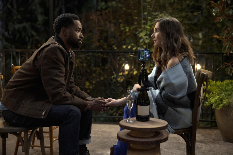 This image released by Amazon Prime Video shows Jay Ellis, left, and Alison Brie in a scene from "Somebody I Used to Know." (Scott Patrick Green/Amazon Prime Video via AP)