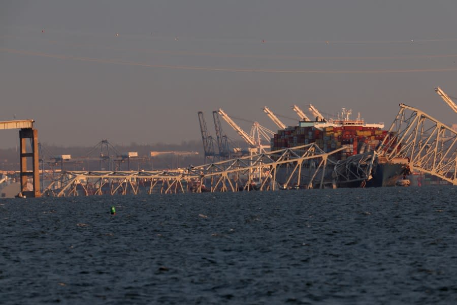 A cargo ship is shown after running into and collapsing the Francis Scott Key Bridge on March 26, 2024 in Baltimore, Maryland. Rescuers are searching for at least seven people, authorities say, while two others have been pulled from the Patapsco River. (Photo by Rob Carr/Getty Images)