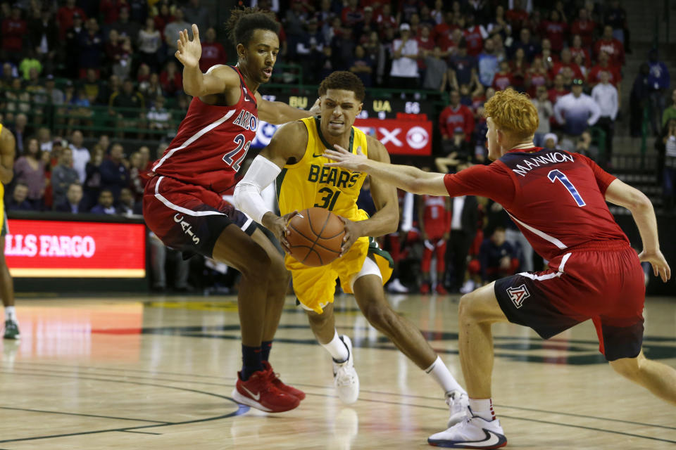 Baylor guard MaCio Teague (31) drives past Arizona forward Zeke Nnaji (22) and Arizona guard Nico Mannion (1) during the second half of an NCAA college basketball game in Waco, Texas, Saturday, Dec. 7, 2019. (AP Photo/Michael Ainsworth)