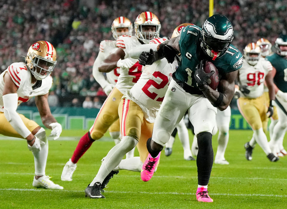 PHILADELPHIA, PENNSYLVANIA – DECEMBER 03: A.J. Brown #11 of the Philadelphia Eagles carries the ball as <a class="link " href="https://sports.yahoo.com/nfl/players/40106/" data-i13n="sec:content-canvas;subsec:anchor_text;elm:context_link" data-ylk="slk:Ji’Ayir Brown;sec:content-canvas;subsec:anchor_text;elm:context_link;itc:0">Ji’Ayir Brown</a> #27 of the <a class="link " href="https://sports.yahoo.com/nfl/teams/san-francisco/" data-i13n="sec:content-canvas;subsec:anchor_text;elm:context_link" data-ylk="slk:San Francisco 49ers;sec:content-canvas;subsec:anchor_text;elm:context_link;itc:0">San Francisco 49ers</a> defends in the third quarter at Lincoln Financial Field on December 03, 2023 in Philadelphia, Pennsylvania. (Photo by Mitchell Leff/Getty Images)