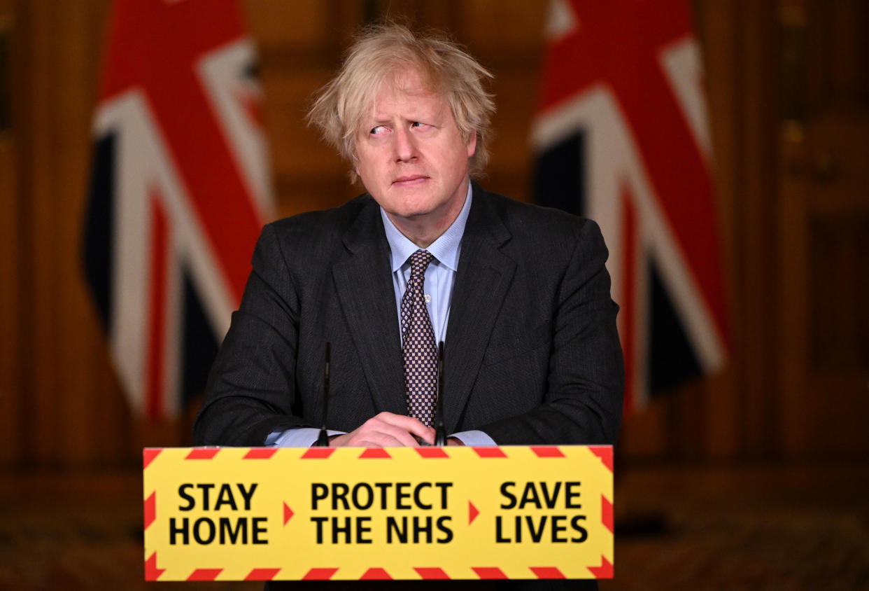 TOPSHOT - Britain's Prime Minister Boris Johnson attends a virtual press conference inside 10 Downing Street in central London on February 22, 2021, after he earlier set out the Government's roadmap out of the third Covid-19 lockdown. - British Prime Minister Boris Johnson on Monday set out a four-step plan to ease coronavirus restrictions, expressing hope that life could get back to normal by the end of June. In a statement to parliament, he outlined a 