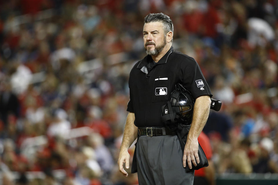 Umpire Rob Drake stands on the field in the x inning of a baseball game between the Atlanta Braves and the Washington Nationals, Friday, Sept. 13, 2019, in Washington. (AP Photo/Patrick Semansky)