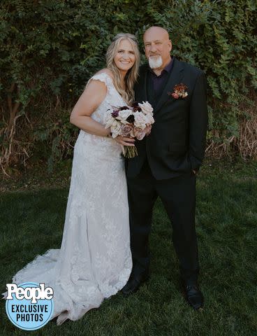 <p>Dani Sork Photo</p> Christine Brown and David Woolley pose on their wedding day.