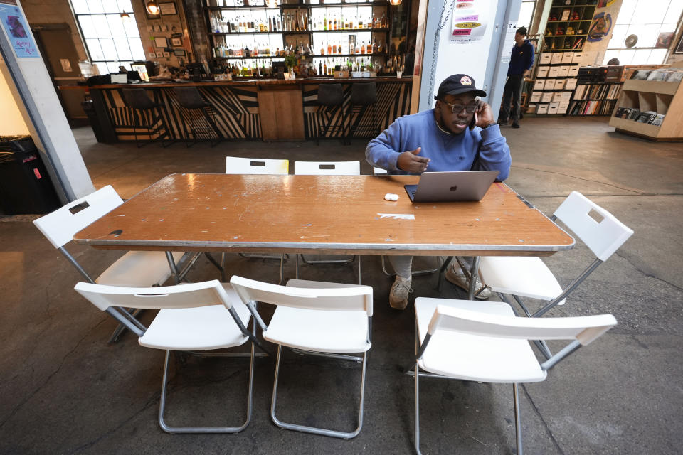 **HOLD FOR COREY WILLIAMS STORY** Kamau Jawara, of Detroit, calls a voter for the Listen to Michigan uncommitted vote campaign in Detroit, Tuesday, Feb. 20, 2024. (AP Photo/Paul Sancya)