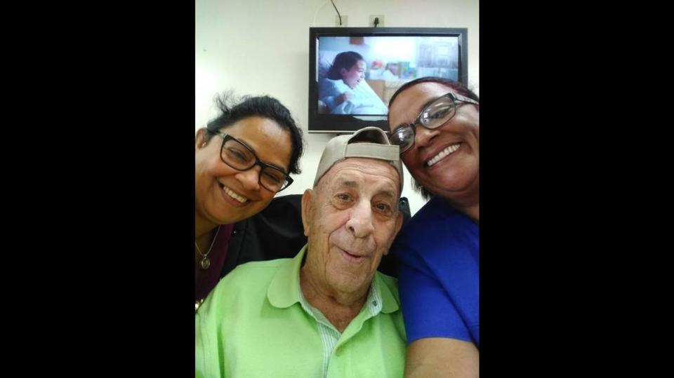 Jose Garcia, a fun-loving Fair Havens resident, smiles with staffers before he became ill with COVID-19.