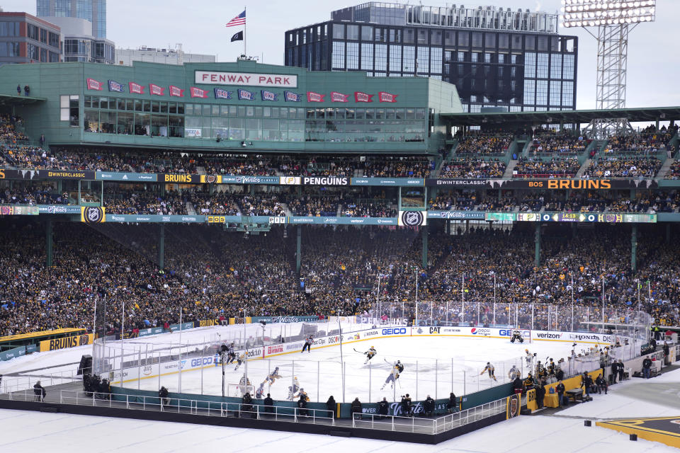 The Pittsburgh Penguins play against the Boston Bruins during the first period of the NHL Winter Classic hockey game at Fenway Park, Monday, Jan. 2, 2023, in Boston. (AP Photo/Charles Krupa)