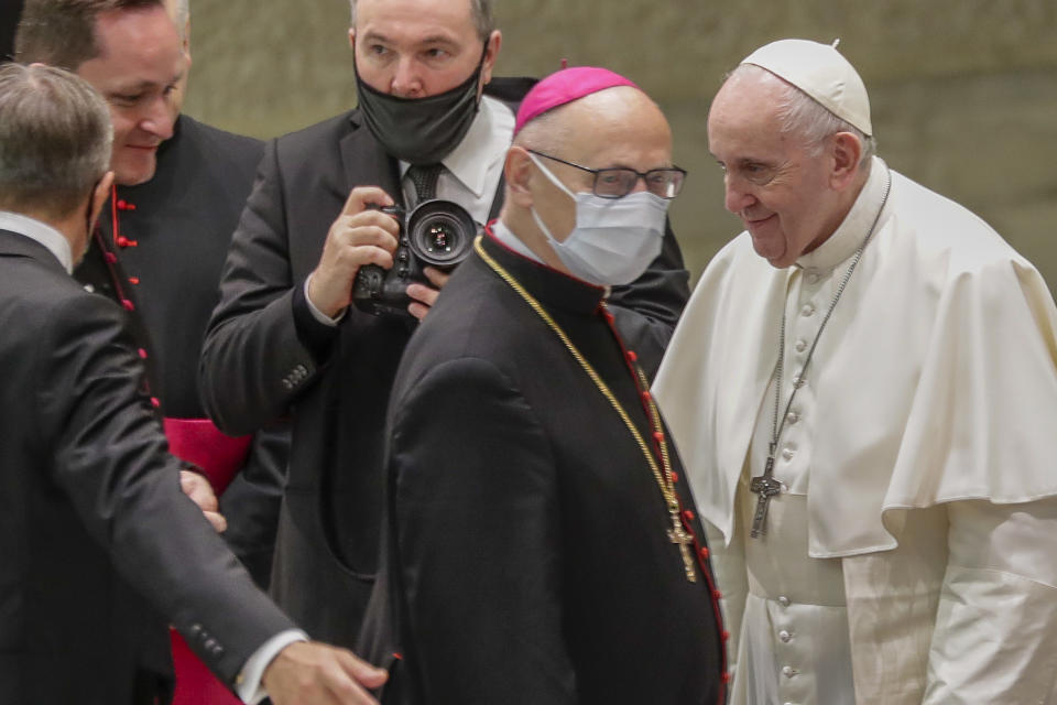 Pope Francis greets prelates at the end of his weekly general audience in the Pope Paul VI hall at the Vatican, Wednesday, Oct. 14, 2020. (AP Photo/Andrew Medichini)