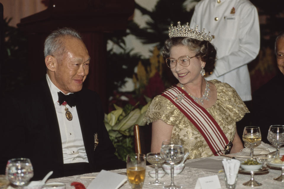 Queen Elizabeth II and Prime Minister of Singapore Lee Kuan Yew attend a state banquet during the Queen's visit to Singapore on 10 October 1989. 