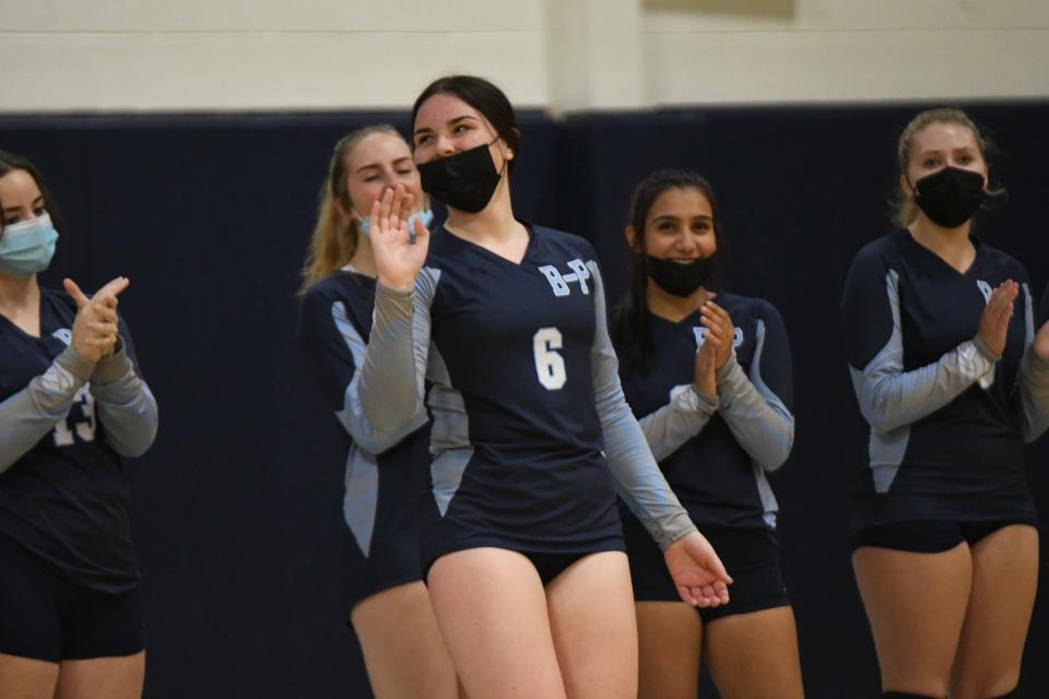 Bristol-Plymouth's Nevaeh Sullivan is applauded by teammates during their Division III preliminary round game against South Shore Christian Academy.