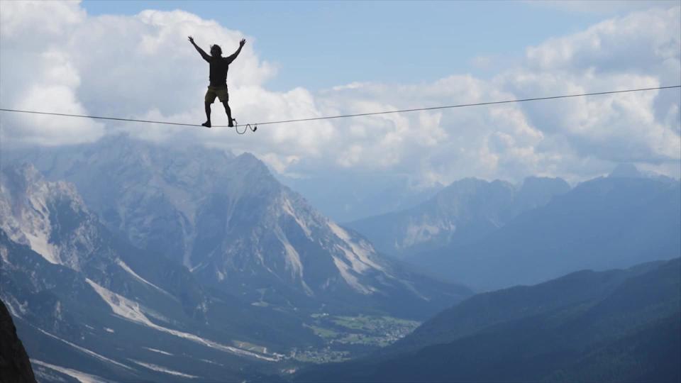 Investors, like this tightrope-walker, are confident that markets and the economy won’t stumble in the years to come.