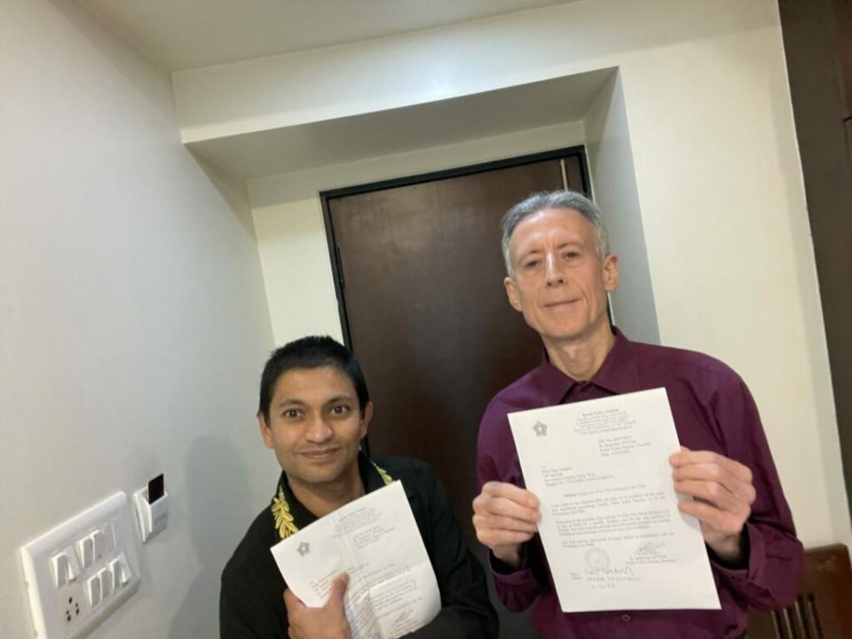 Tatchell (right) and Pliny Soocoormanee with their police notice (Image: Provided)