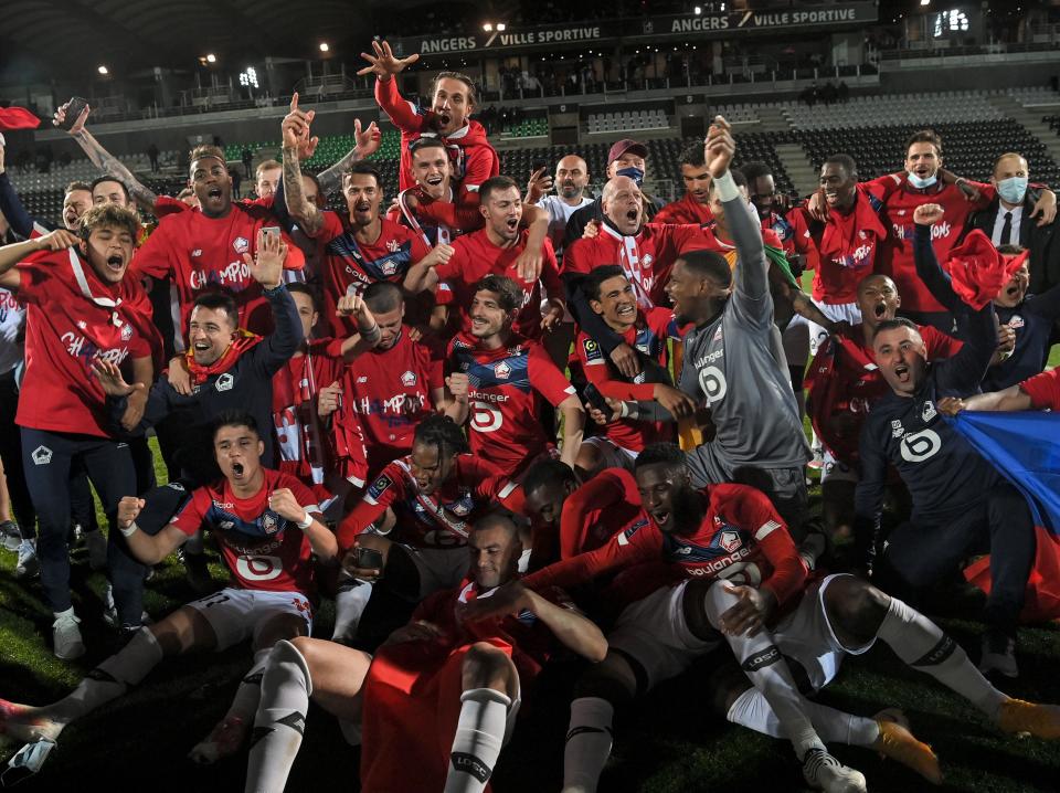 Lille players and staff celebrate their title triumph (AFP via Getty Images)