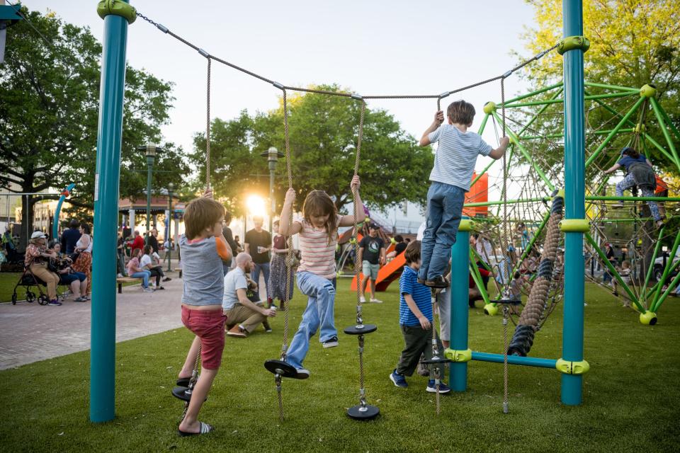 Kids playing at the Playground at Parc Sans Souci