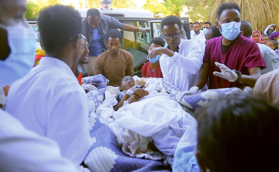 In this image made from video, an injured victim of an alleged airstrike on a village arrives in an ambulance at the Ayder Referral Hospital in Mekele, in the Tigray region of northern Ethiopia, Wednesday, June 23, 2021. An airstrike hit a busy market in Ethiopia's northern Tigray village of Togoga on Tuesday and killed at least 51 people, according to health workers who said soldiers blocked medical teams from traveling to the scene. (AP Photo)