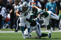 Carolina Panthers running back Christian McCaffrey runs against the New York Jets during the first half of an NFL football game Sunday, Sept. 12, 2021, in Charlotte, N.C. (AP Photo/Nell Redmond)