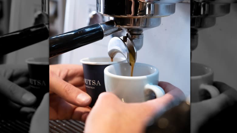 espresso machine hands cups