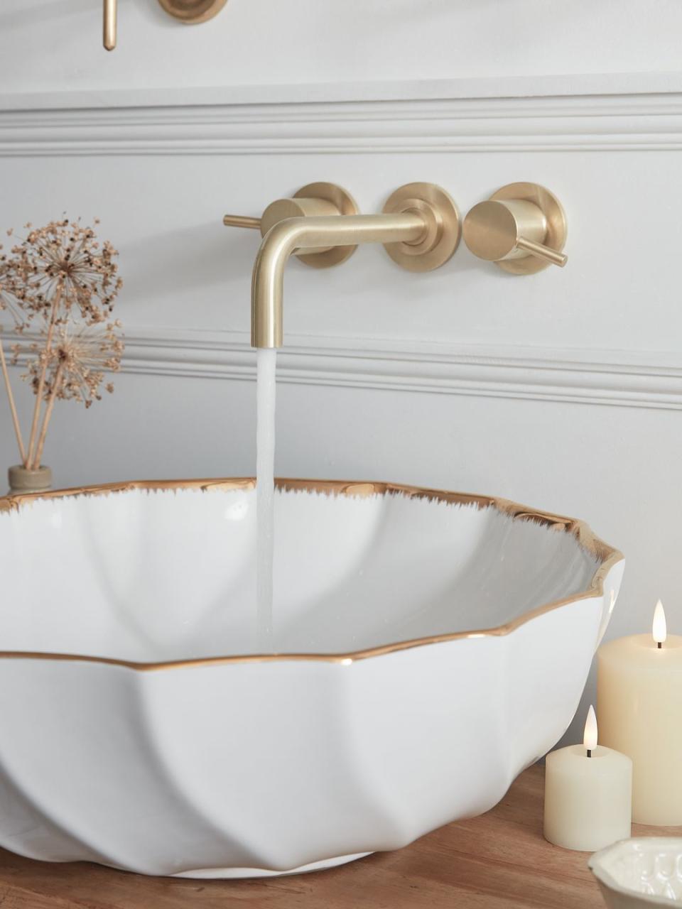 <p>Spas signal luxury and indulgence, aspects which can be introduced through the design of your spathroom. Consider materials such as brass, creamy white porcelain or marble, and take care with your details – we love this scalloped basin that you can find on sites like Etsy. </p><p>Pictured: <a href="https://www.lights4fun.co.uk/collections/indoor-battery-pillar-candles" rel="nofollow noopener" target="_blank" data-ylk="slk:LED Pillar Candles at Lights4fun;elm:context_link;itc:0;sec:content-canvas" class="link ">LED Pillar Candles at Lights4fun</a>, for a similar scalopped basin, <a href="https://www.etsy.com/uk/listing/1276032709/marble-bowl-lotus-sink-marble-wash-basin" rel="nofollow noopener" target="_blank" data-ylk="slk:try Etsy;elm:context_link;itc:0;sec:content-canvas" class="link ">try Etsy</a></p>