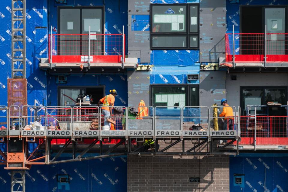 Construction workers at the site of an affordable housing project in Ottawa on Sept. 28, 2023.