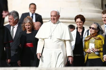 Pope Francis arrives for a gathering of elderly people at the Vatican September 28, 2014. REUTERS/Tony Gentile