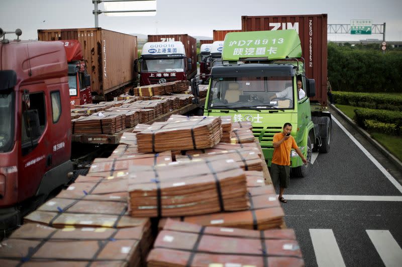 FILE PHOTO: FILE PHOTO: File photo of trucks carrying copper and other goods in Shanghai