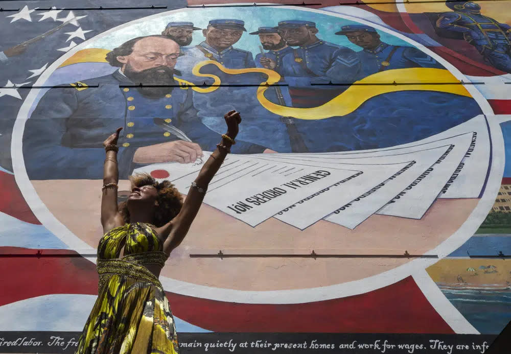 Dancer Prescylia Mae, of Houston, performs during a dedication ceremony for the massive mural “Absolute Equality” in downtown Galveston, Texas, on June 19, 2021. (Stuart Villanueva/The Galveston County Daily News via AP, File)