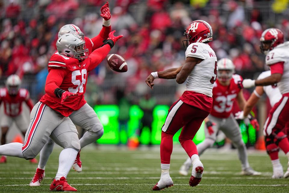 Nov 12, 2022; Columbus, Ohio, USA;  Ohio State Buckeyes defensive tackle Ty Hamilton (58) knocks down a pass by Indiana Hoosiers quarterback Dexter Williams II (5) during the second half of the NCAA football game at Ohio Stadium. Ohio State won 56-14. Mandatory Credit: Adam Cairns-The Columbus Dispatch