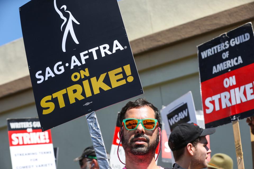 SAG-AFTRA member Charles Mastropietro stands on the picket line at Paramount studios on July 14, 2023. SAG-AFTRA authorized their members to strike after contract talks with movie and television producers broke down on July 13. The actors join members of the Writers Guild of America which has been on the picket lines for over two months.