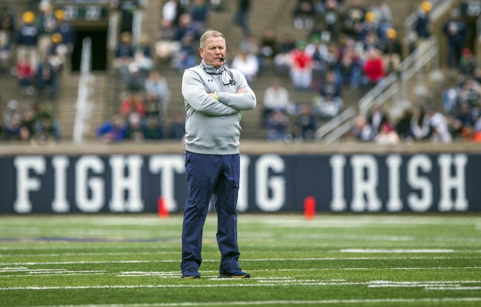 FILE - In this April 21, 2018, file photo, Notre Dame head coach Brian Kelly watches during the Notre Dame Blue-Gold Spring college football game in South Bend, Ind. Brian Kelly is The Associated Press college football Coach of the Year, Monday, Dec. 17, 2018, becoming the third coach to win the award twice since it was established in 1998. (Robert Franklin/South Bend Tribune via AP, File)