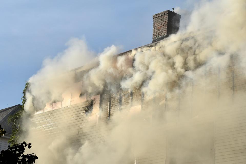 Thick smoke billows from the building on fire at 277 Brightman St. Tuesday evening in Fall River.
