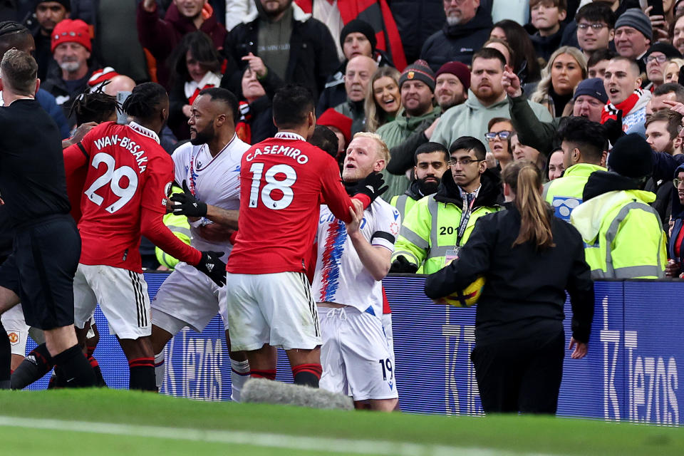 MANCHESTER, ENGLAND - FEBRUARY 04: Casemiro of Manchester United clashes with Will Hughes of Crystal Palace leading to a red card decision during the Premier League match between Manchester United and Crystal Palace at Old Trafford on February 04, 2023 in Manchester, England. (Photo by Alex Livesey/Getty Images)