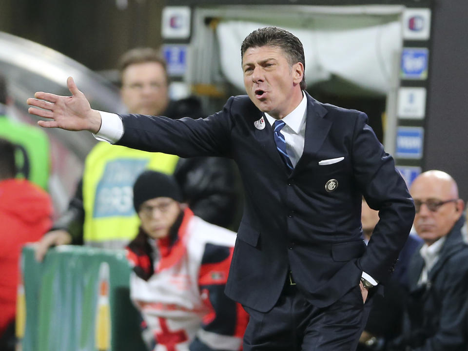 Inter Milan coach Walter Mazzarri gestures during the Serie A soccer match between Inter Milan and Udinese at the San Siro stadium in Milan, Italy, Thursday, March 27, 2014. (AP Photo/Antonio Calanni)