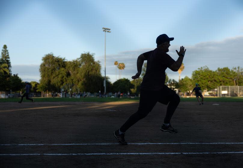 STUDIO CITY, CA - AUGUST 10: A Writers Guild of America softball league game takes place at Studio City Recreation Center on Thursday, Aug. 10, 2023. The weekly games have given writers and actors something to look forward to during the strikes. (Myung J. Chun / Los Angeles Times)