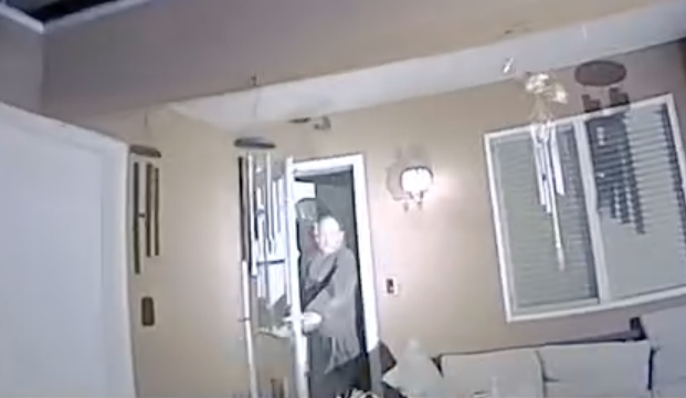 A screen grab from body camera footage released by the Farmington Police Department shows Robert Dotson, 52, in his doorway before he was shot and killed by police officers on April 5, 2023.  / Credit: Farmington Police Department