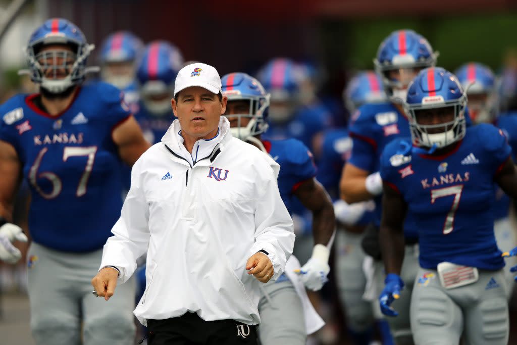 Head coach Les Miles of the Kansas Jayhawks leads players onto the field prior to the game against the Oklahoma Sooners at Memorial Stadium on October 05, 2019 in Lawrence, Kansas. (Photo by Jamie Squire/Getty Images)