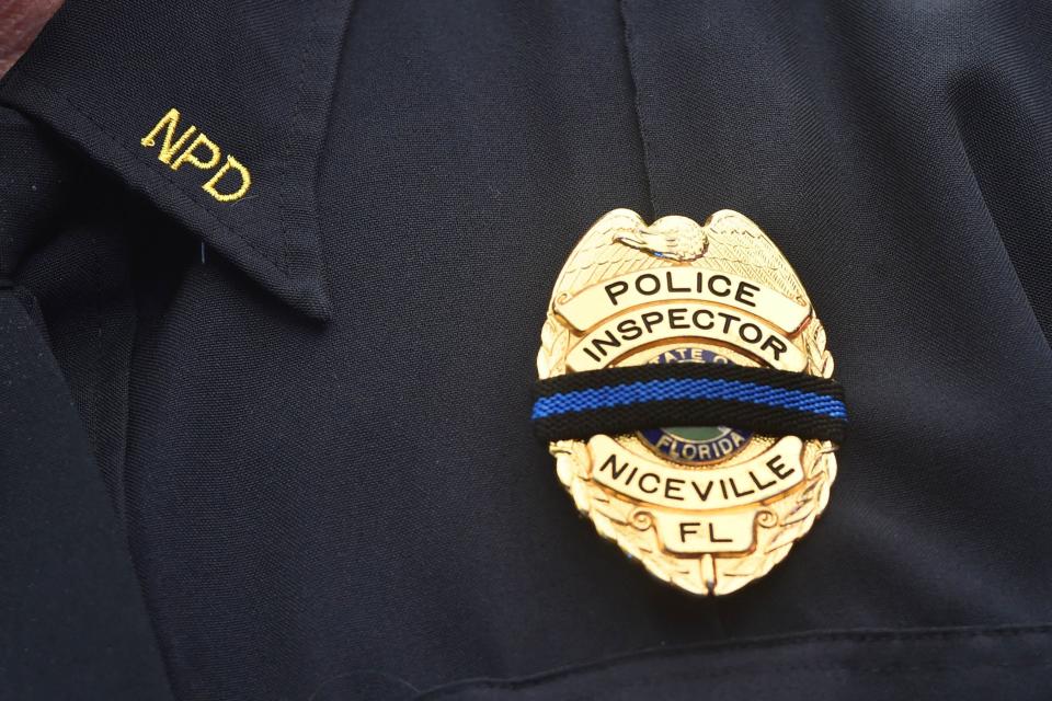 Niceville Police officers gathered with other law enforcement personnel from Northwest Florida to mourn and celebrate the life of Niceville K-9 Officer Blue, who died Aug. 7 in a traffic accident.