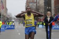 Lelisa Desisa of Ethiopia reacts after winning the men's division of the 119th Boston Marathon in Boston, Massachusetts April 20, 2015. REUTERS/Brian Snyder