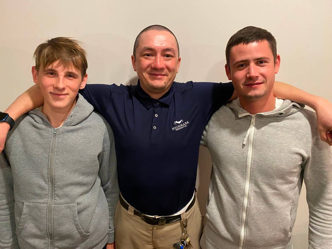 Azamat Allaiarov, center, stands with the two young Ukrainian men he has adopted into his Raleigh apartment: Vlad Horokhov, 20, and Yevhenii Bykhovets, 27. Allaiarov came to the United States four years ago as a Russian refugee seeking political asylum.