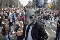 People attend a protest in front of the Serbian parliament in Belgrade