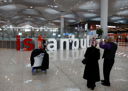 Passengers take photos at the city's new Istanbul Airport in Istanbul, Turkey, April 6, 2019. REUTERS/Umit Bektas