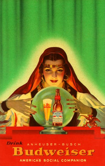 The Budweiser beer ad depicts a clairvoyant standing over a glass ball containing a bottle of Budweiser.